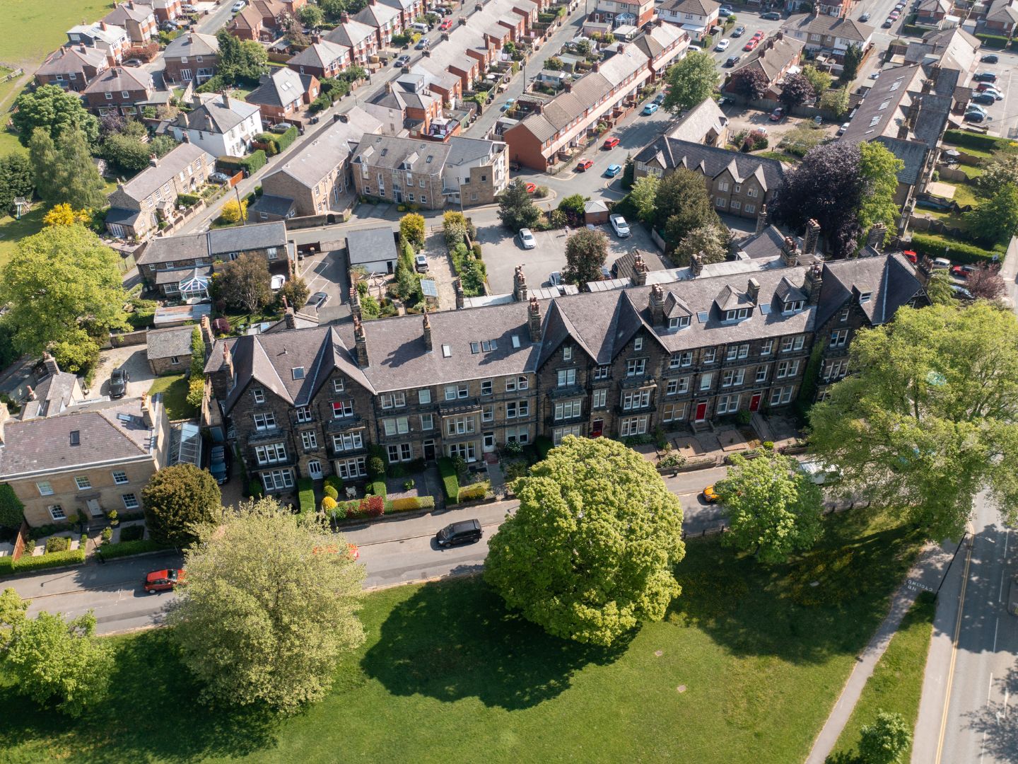 An aerial shot of Harrogate showing rows of buildings and leafy trees. 